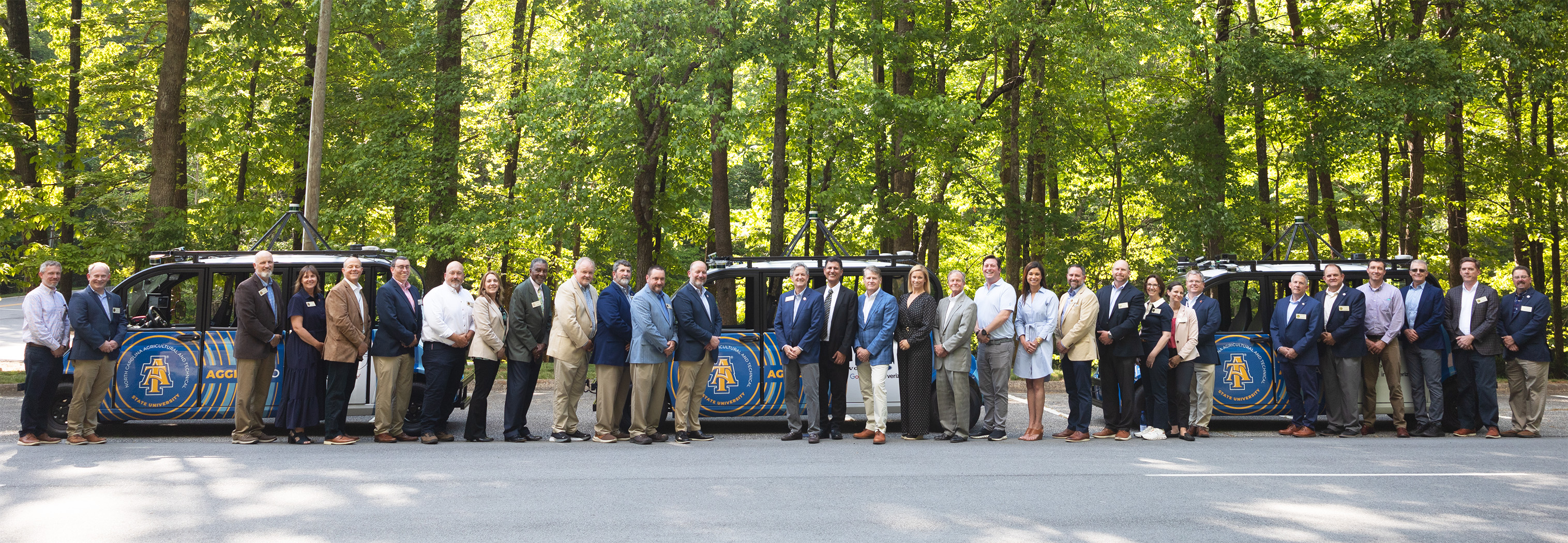 A&T student leaders join A&T Four member Joseph McNeil, Chancellor James R. Martin II and sculptor James Barnhill in front of the February One monument created by Barnhill in 2002.