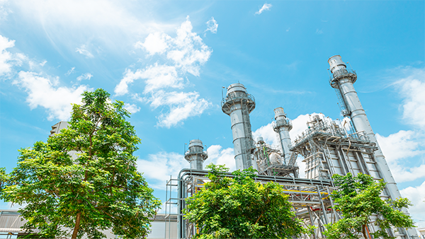 Manufacturing facility with trees around it